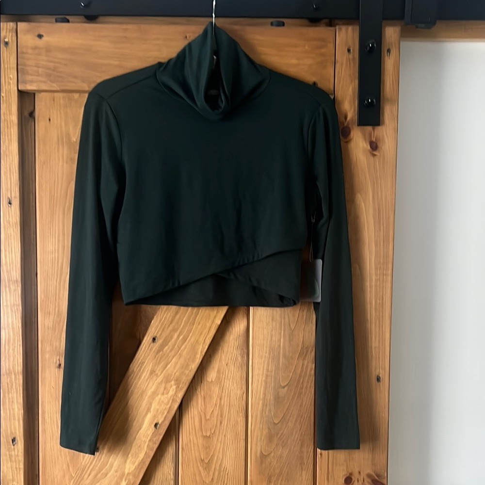 Green cropped long sleeve top with mock neck and asymmetrical style